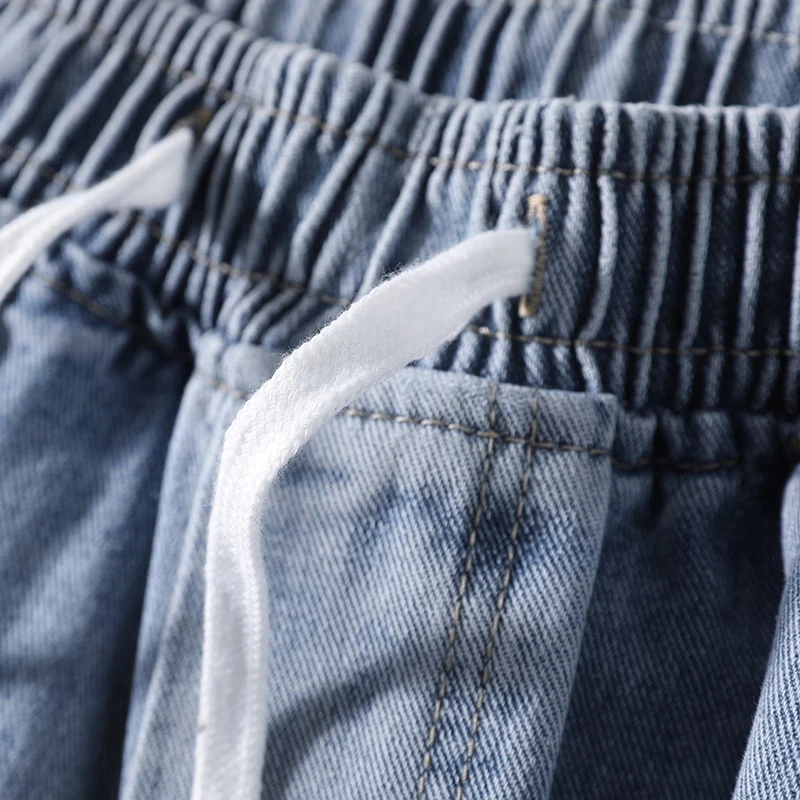 الرجال الدانتيل متابعة تمتد واسعة الساق الجينز 2025 جديد عصري موضة فضفاض سراويل تقليدية العلامة التجارية الكلاسيكية مرونة الخصر الذكور سراويل جينز