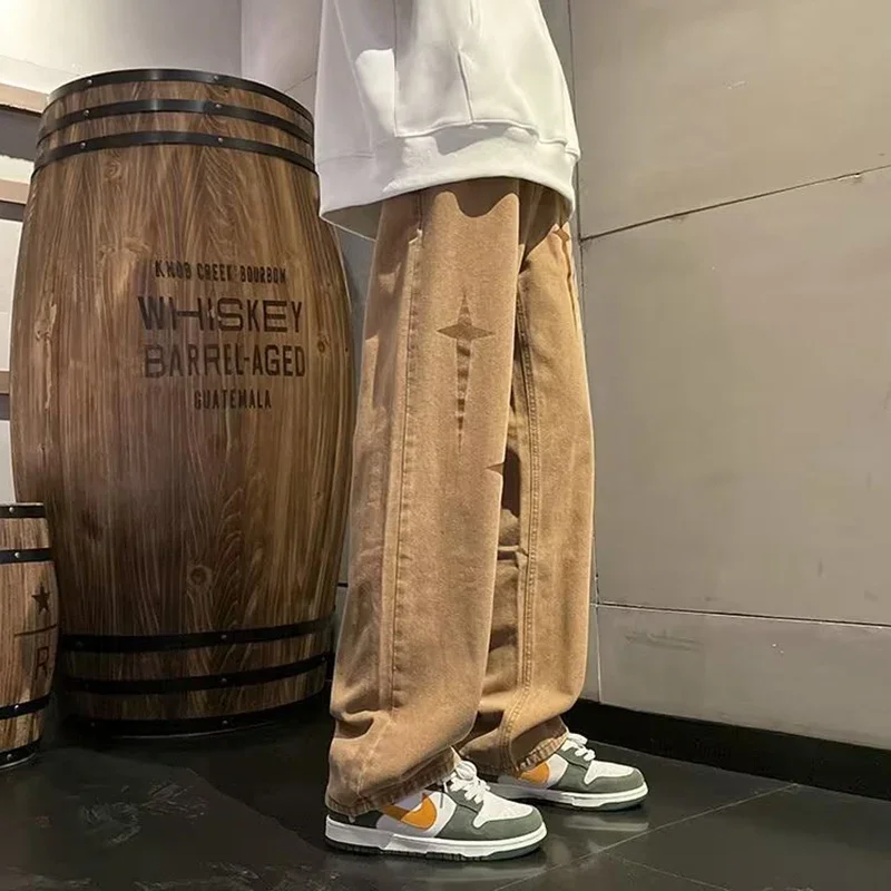 2025 ขายร้อน Distressed พิมพ์กางเกงยีนส์ผู้ชายใหม่หลวม Bell Bottoms อินเทรนด์ Hip Hop ตรงกางเกงสบายๆสไตล์อเมริกันกางเกงยีนส์ผู้ชาย