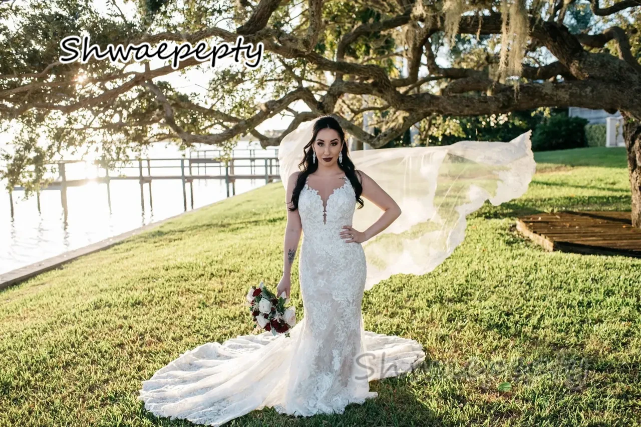 Gaun pernikahan putri duyung renda belakang ilusi seksi gaun pengantin pantai Boho kereta panjang tanpa lengan gaun pengantin musim panas buatan khusus