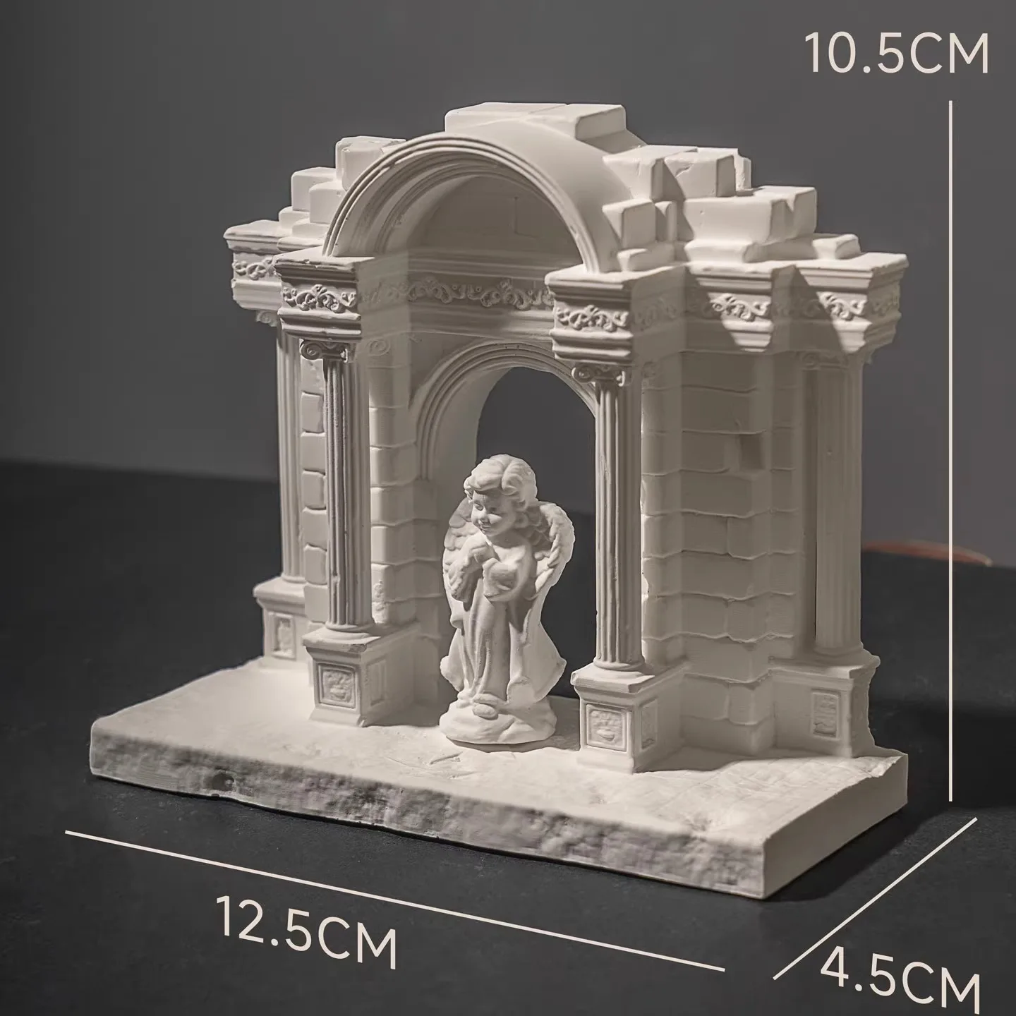 European-style retro gate with Roman columns, cement/plaster decorative art pieces (including little cherubs).