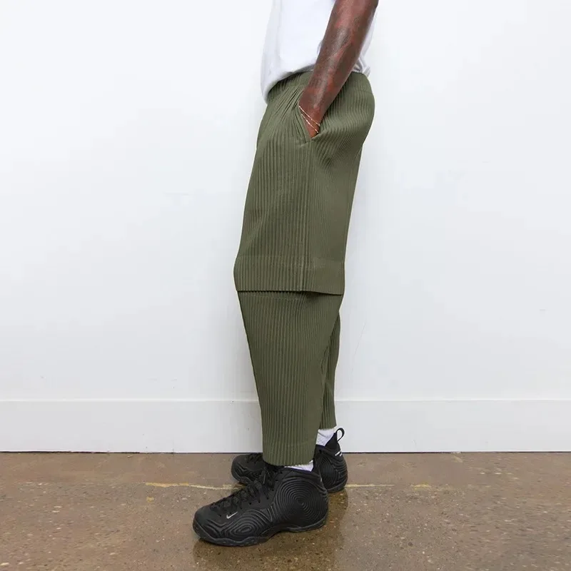 Celana Kasual Pria Pakaian Kerja Komuter Kerja Gaya Desainer Berlipat Miyake dengan Saku Celana Sembilan Fashion Melar Sederhana