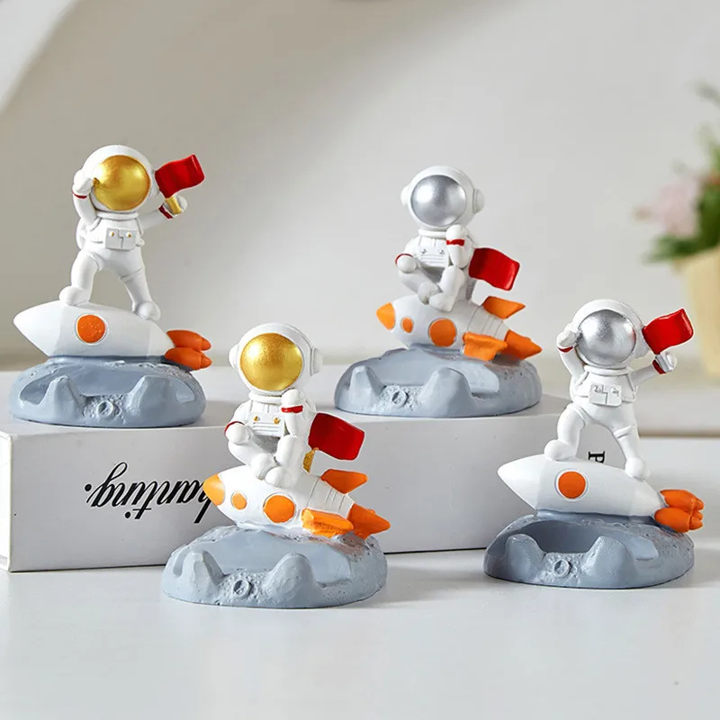 Creative Astronaut Ornaments Office Desk Decoration Spaceman Bracket Mobile Phone Stand Holder with Flags and Rockets Toys Gift