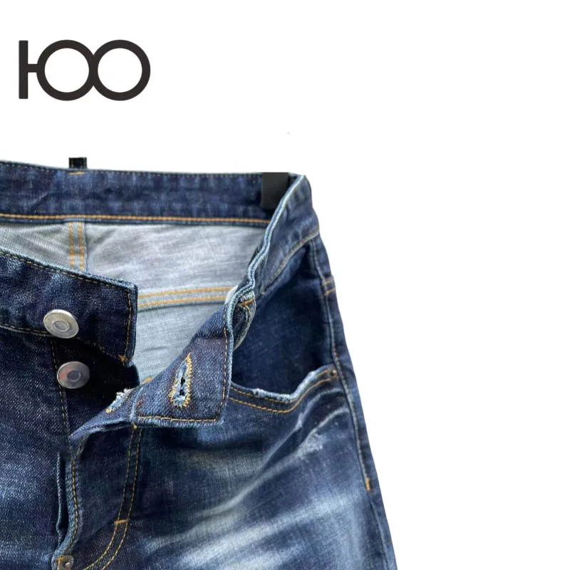 100 C092 Men's denim pants – washed to a rugged vintage finish, with raw-ripped holes and bold paint stamps, cut in a sharp sli