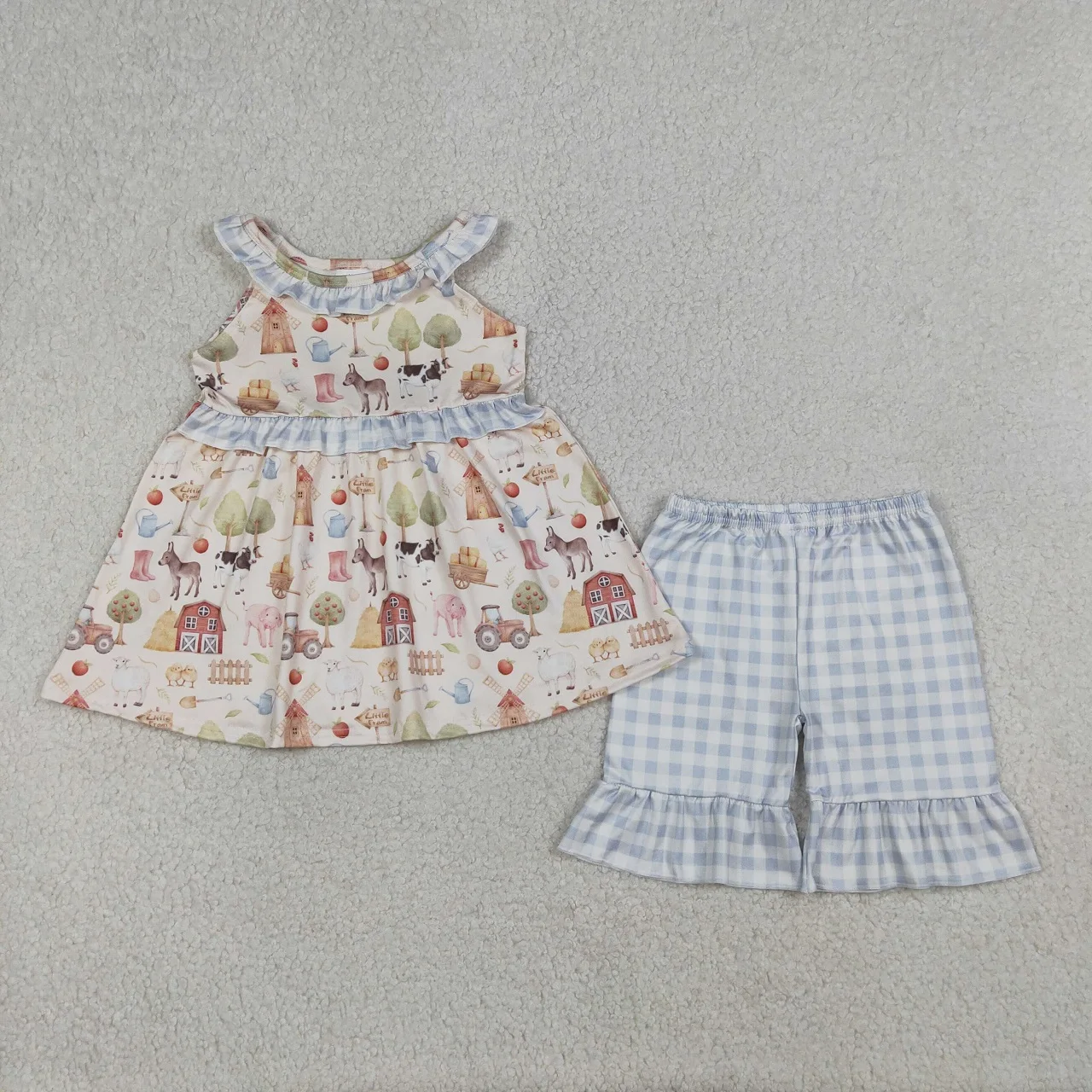 atacado-conjunto-infantil-feminino-de-verao-com-tunica-sem-mangas-estampa-animais-da-fazenda-e-shorts-xadrez-com-babados-para-bebes-e-criancas