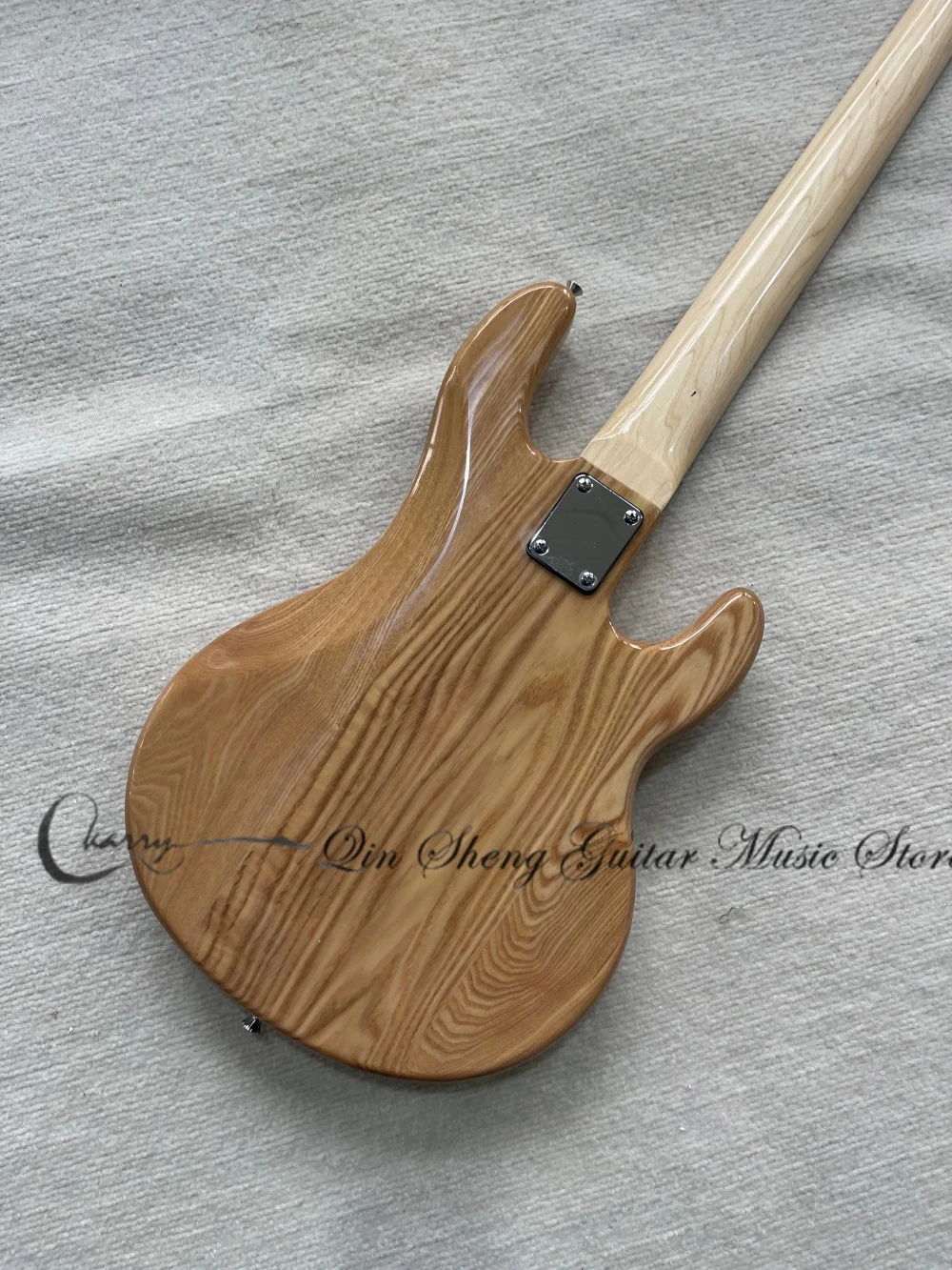 Left-handed bass, 5-string natural bass, Ash wood body, bridge, black pickup plate, chrome hardware. view 4