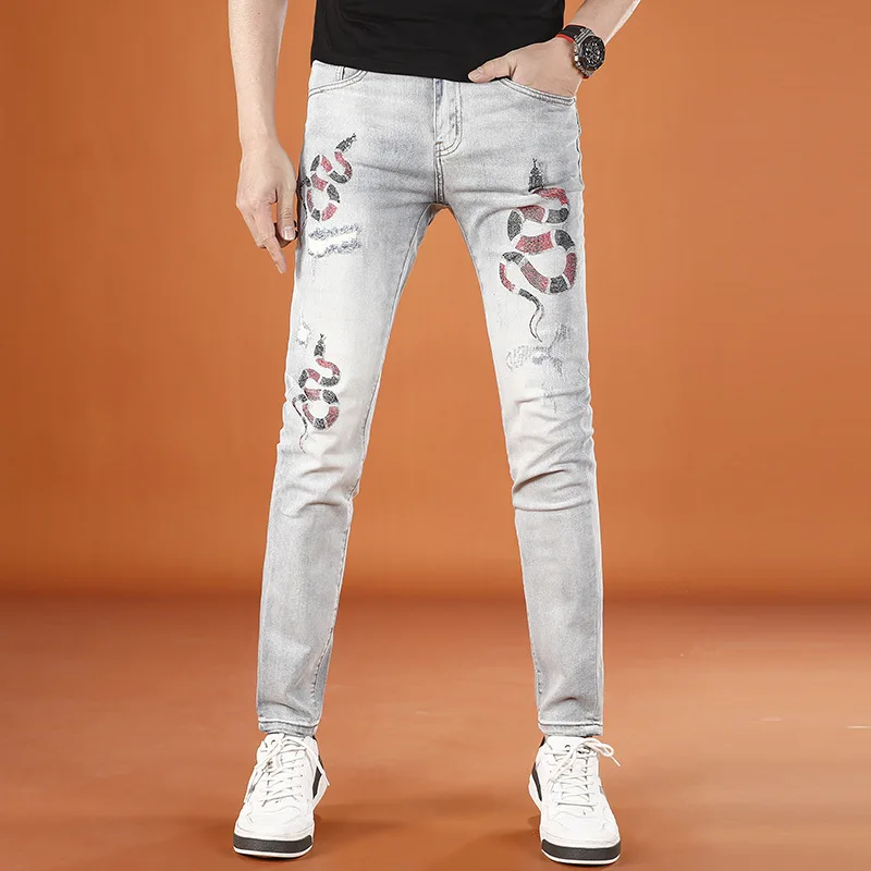 

Summer thin snake year printed jeans for men, light luxury fashion trend brand, perforated elastic slim fit small leg pants