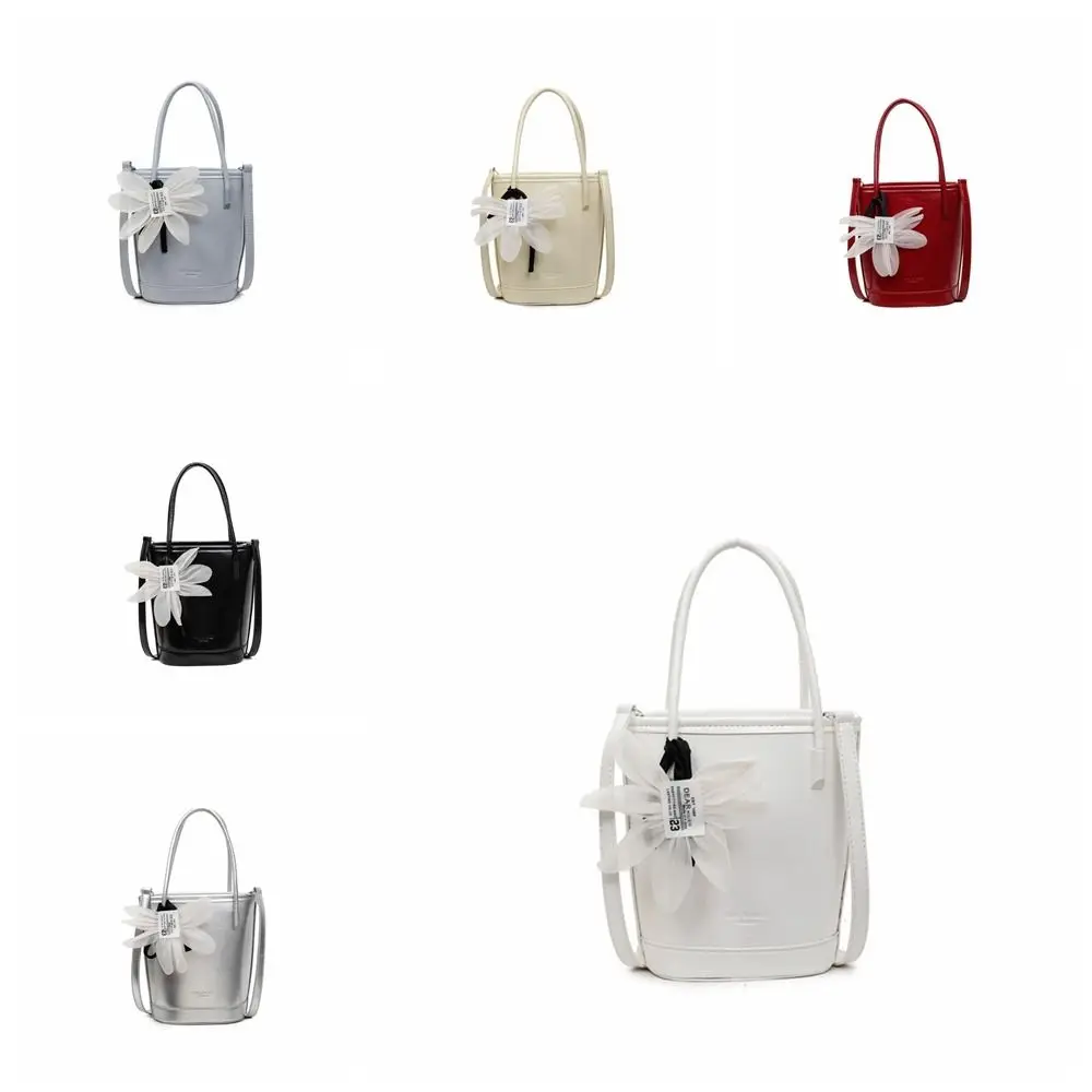 Modieuze Pu lederen bloemenemmertas met hanger Grote capaciteit dameshandtas Elegante effen kleur Crossbody tas buiten