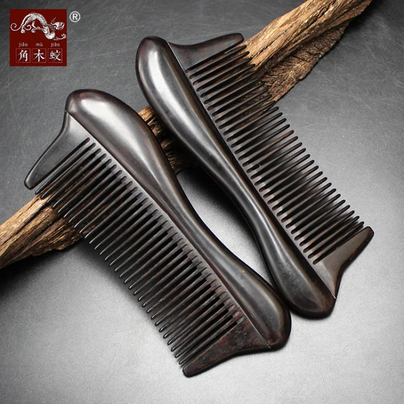 

Ebony black sandalwood comb with fine teeth and a raised edge