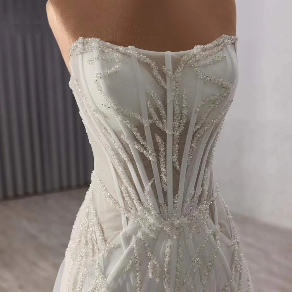 فستان زفاف من Fساتين زفاف بدون حمالات مطرز بالكريستال بدون أكمام وأربطة من الخلف فستان زفاف مثير