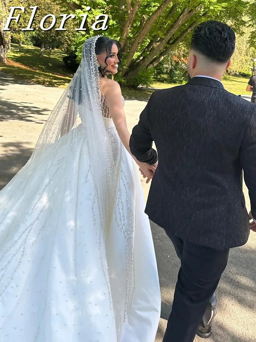 ชุดแต่งงานแบบมีลูกปัดมุกหรูหราสั่งทำพิเศษ แขนยาว พร้อมกระโปรงแบบถอดได้