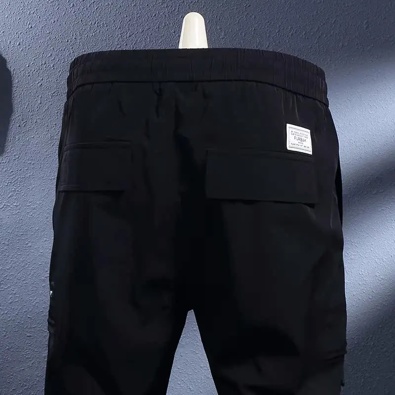 

Summer thin black ice silk breathable elastic slim fit casual pants for men, Korean version trendy quick drying sports pants