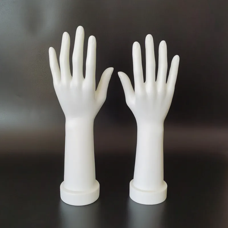 A pair of female mannequin hands used to display gloves, bracelets, rings, and jewelry on a female hand model stand