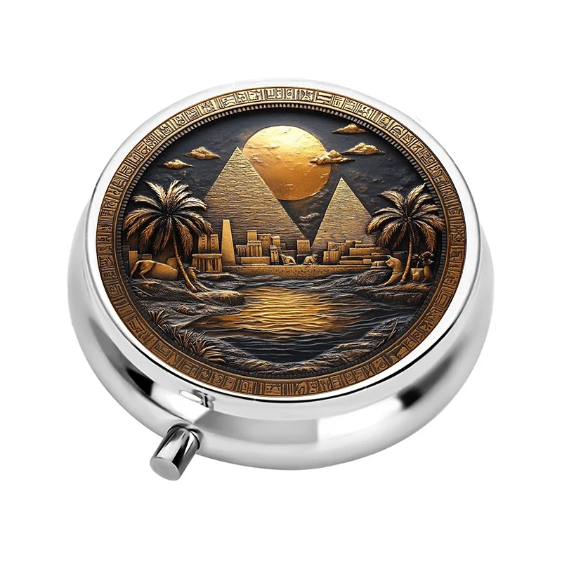 A portable pill box with a three-compartment design, featuring an ancient Egyptian theme. This compact medicine organizer is perfect for keeping in a purse or handbag and also makes a unique travel gift.