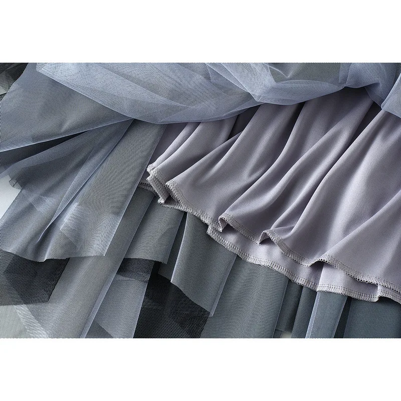 Falda larga por debajo de la rodilla de tul Irregular para primavera y verano para mujer con cinturón negro blanco Casual elegante faldas de malla de cintura alta 2025