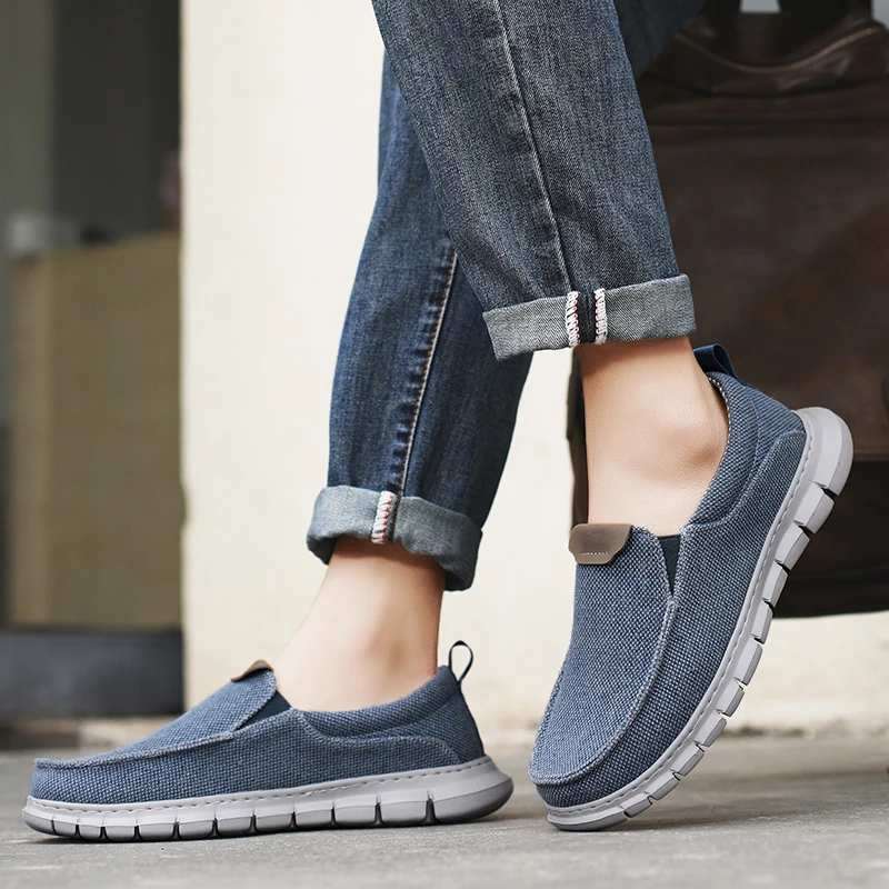 Sneakers scarpe da uomo mocassini Casual in tela tinta unita Slip On Flats classiche comode scarpe da uomo morbide e traspiranti di grandi dimensioni