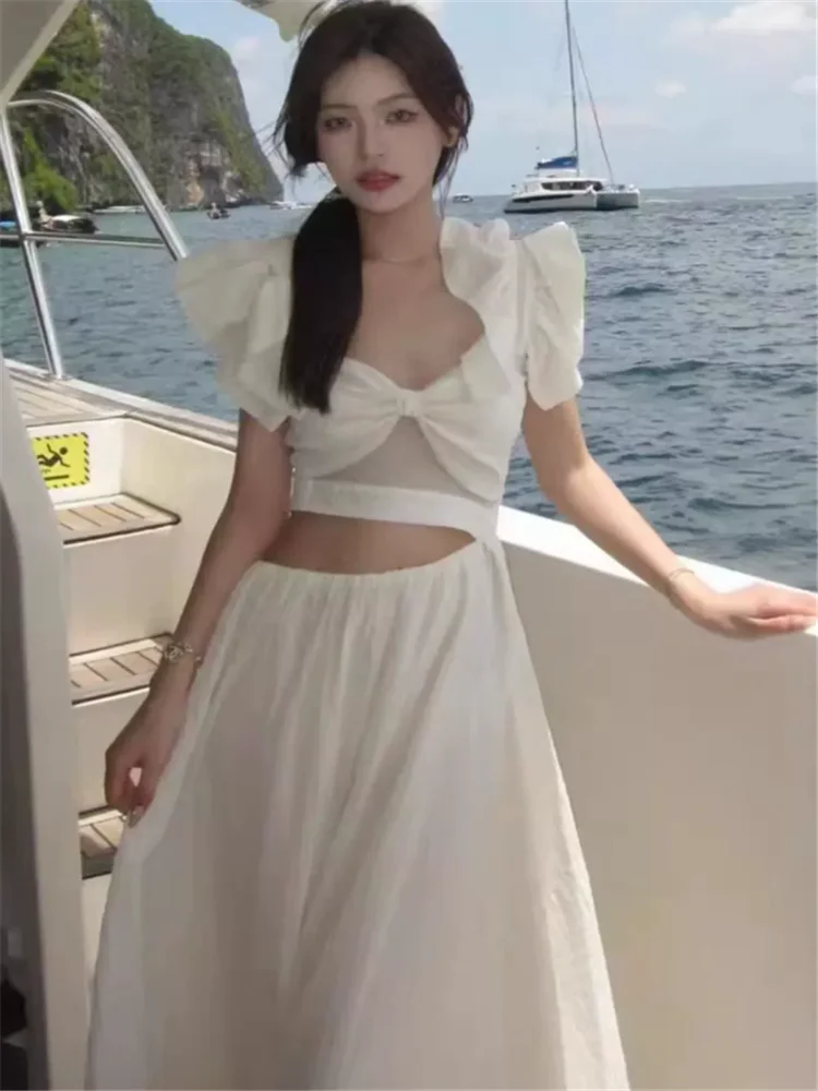 

Новое летнее модное праздничное пляжное длинное платье с оборками и летающими рукавами, женское белое, фиолетовое, с полым поясом и бантом, трапециевидное платье миди