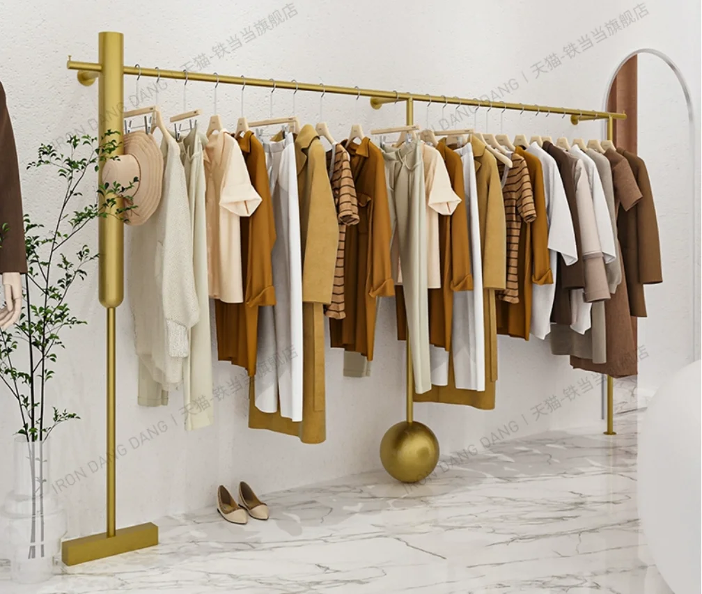 Clothing store shelves, wrought iron gold wall hanging hangers, clothing racks, women's clothing store dedicated display racks