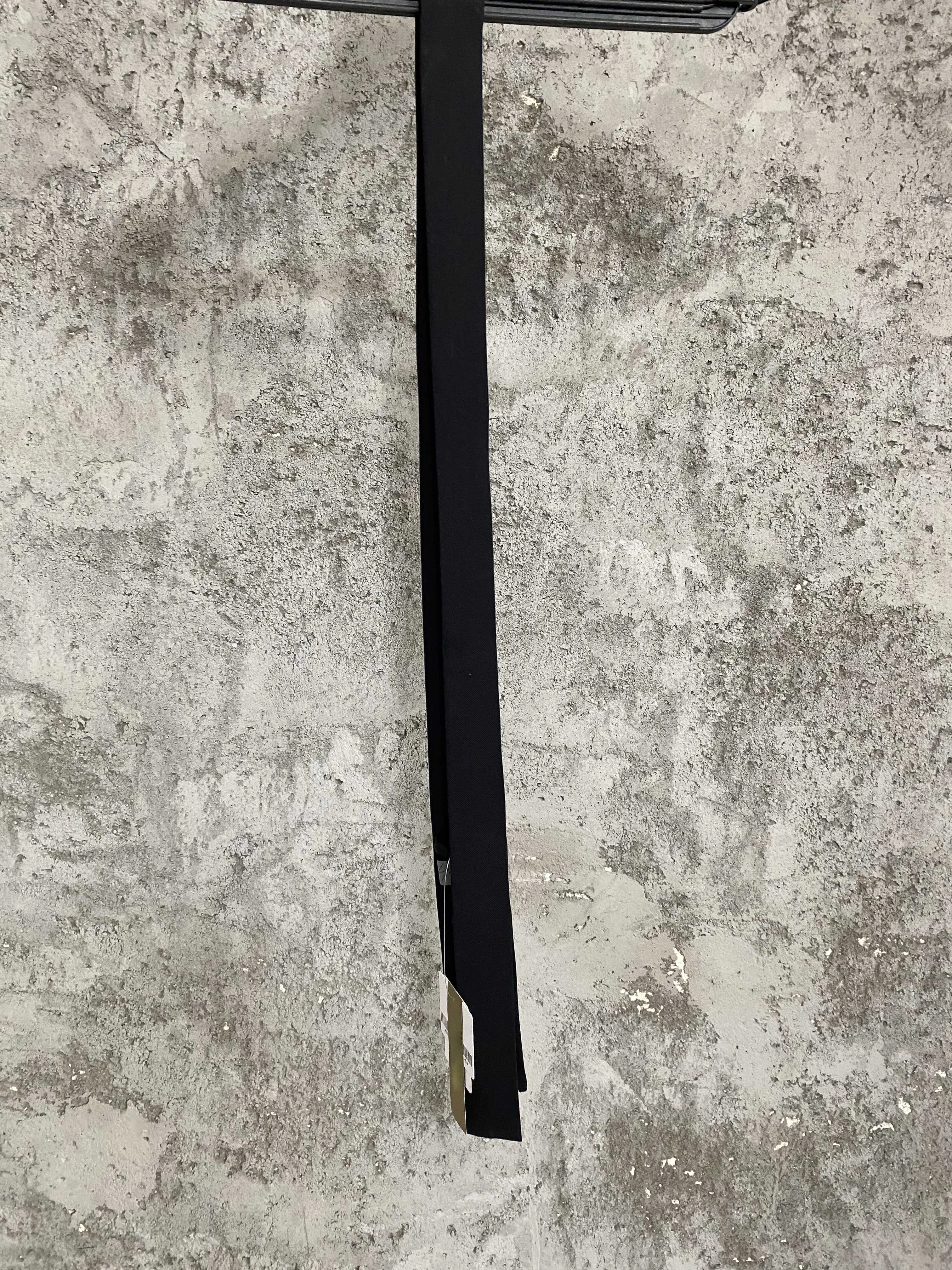 A man and a woman who created a Chinese-embroidered wool tie have resigned from their original dark-themed design