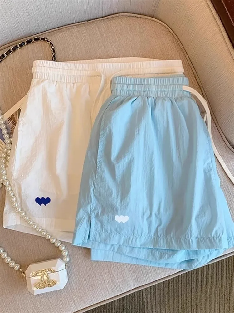 

Hong Kong Sle Casual Dstring Heart Print ort Pants Men Women Summer Faionable Loose Fit Spor Five-Quarter Length