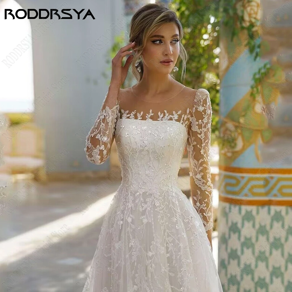 RODDRSYA رائعة تول فساتين الزفاف طويلة الأكمام مغرفة الرقبة فساتين العروس الوهم الظهر زين خط vestidos de noviaRoddrsya غرامة الشاش فستان الزفاف كم طويل فضفاض السرة ثوب الزفاف فانتوم ظهر حرف الشارات