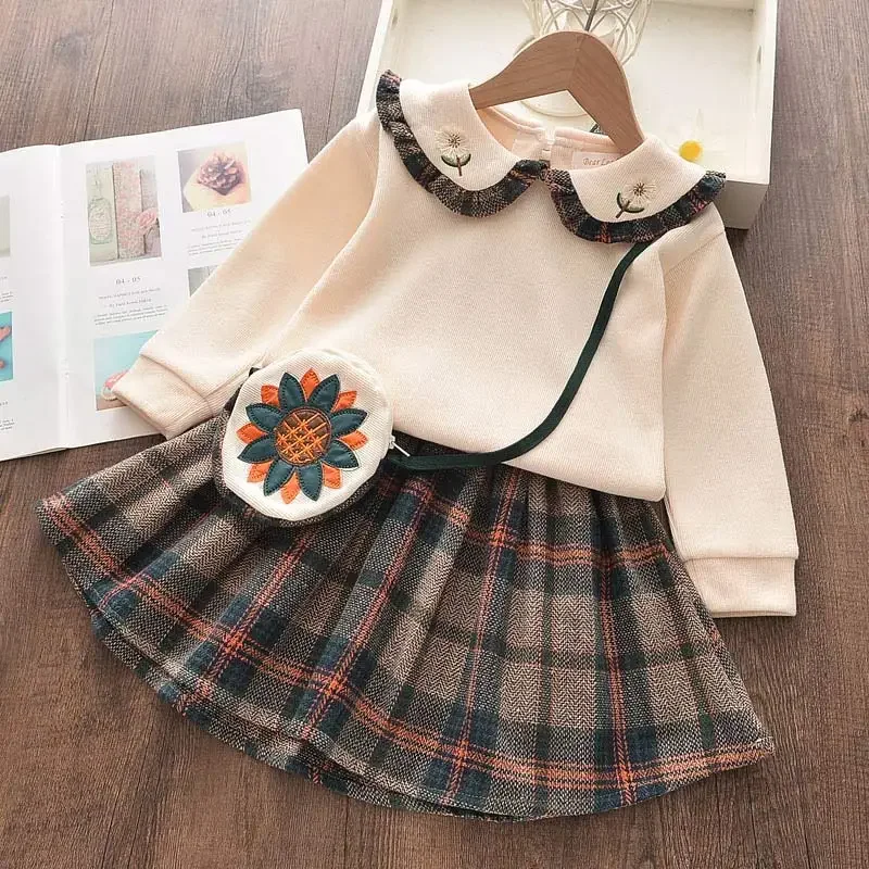 Herbst und Winter Mädchen lang ärmel igen kurzen Rock Set dreiteilige Sonnenblumen tasche gespleißt gefalteten Puppen hals Kinder kleidung Mädchen