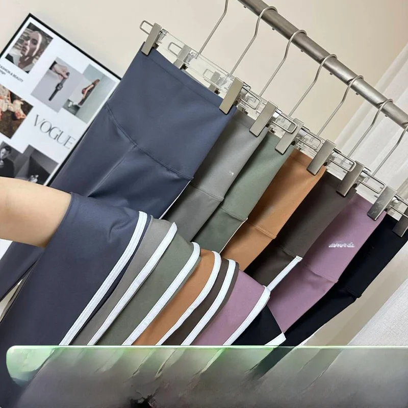 2025 Nuovi pantaloni da yoga slim fit elastici in pelle arca Abbigliamento da esterno da donna Pantaloni da yoga sportivi in nylon a vita alta a nove punti