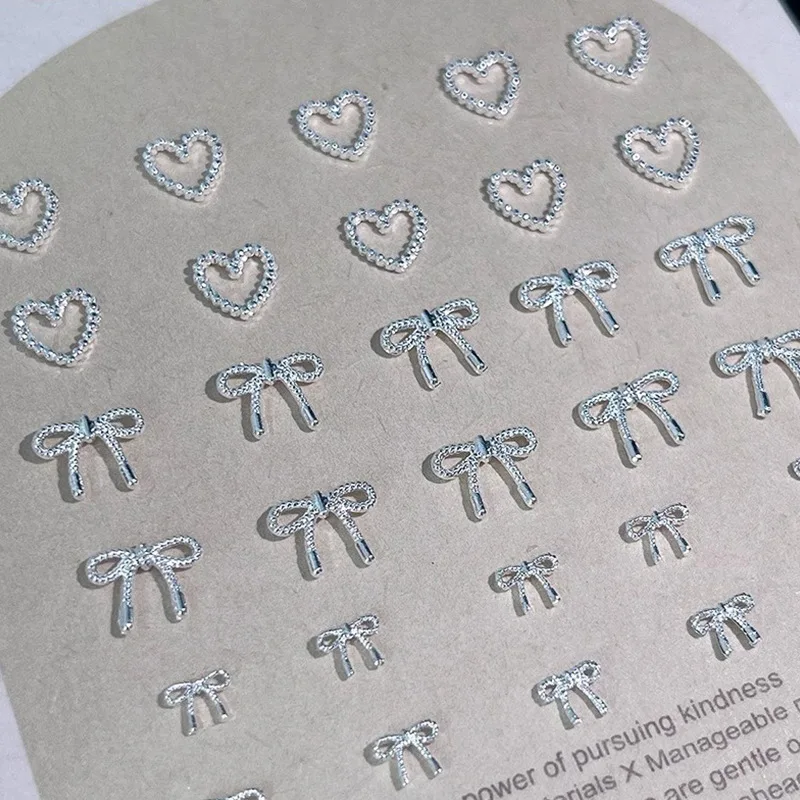 50 pz Lega Arco Cuore Pendenti E Ciondoli Per Unghie Accessori 3D Argento Piccolo Bowkont Ornamenti a forma di Cuore Unghie artistiche Decorazioni Forniture FAI DA TE