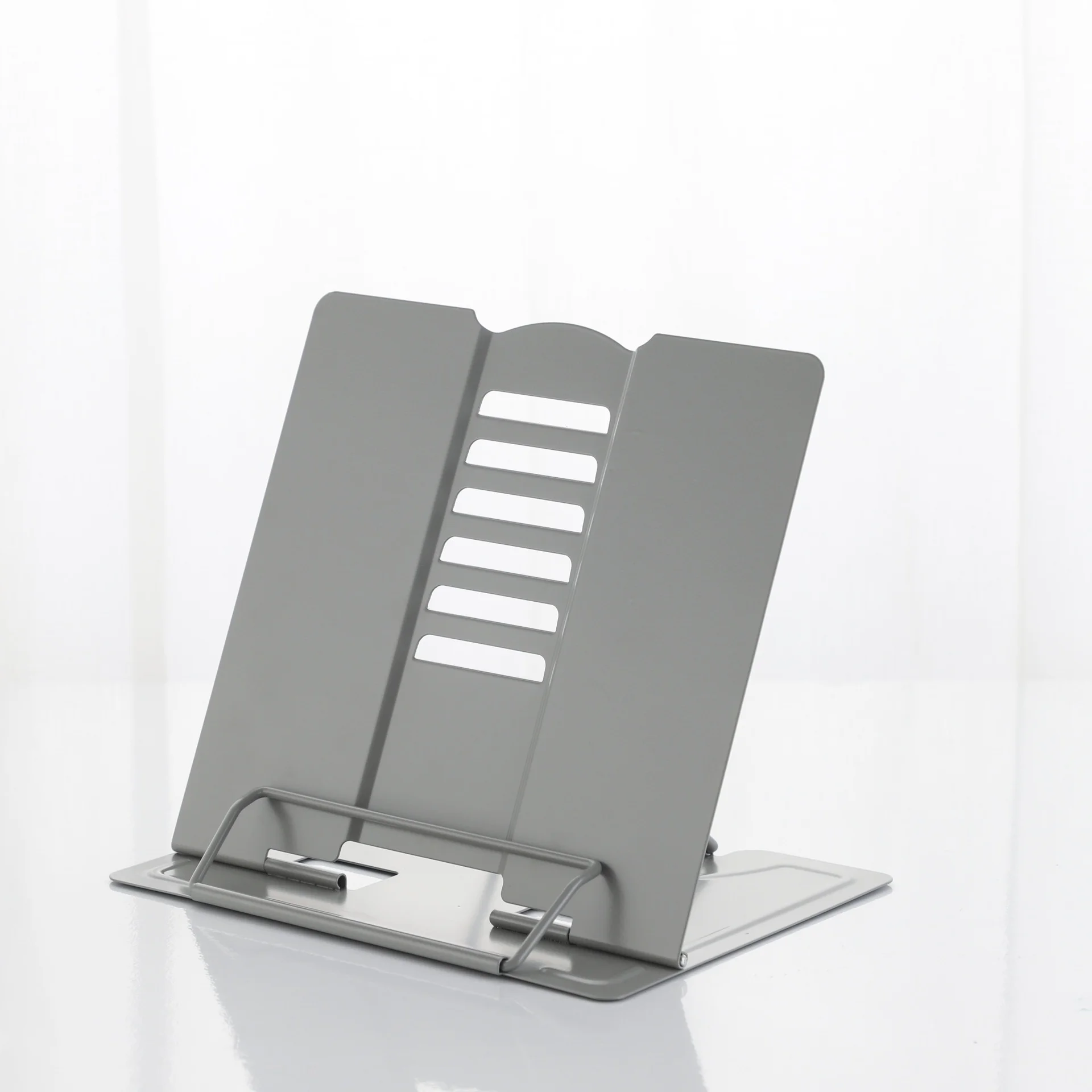 Metal reading stand for students looking up at bookshelves and storing books on their desks