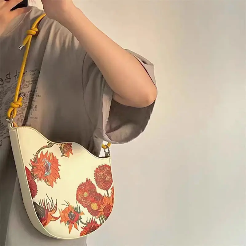 2025 new fashion women's leather leather retro sunflower seed rope knot and color paint series handheld armpit crossbody bag