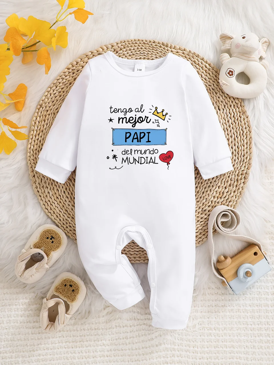 A baby long-sleeved onesie with interesting letter prints. It features a buttoned design for easy putting on and taking off, and