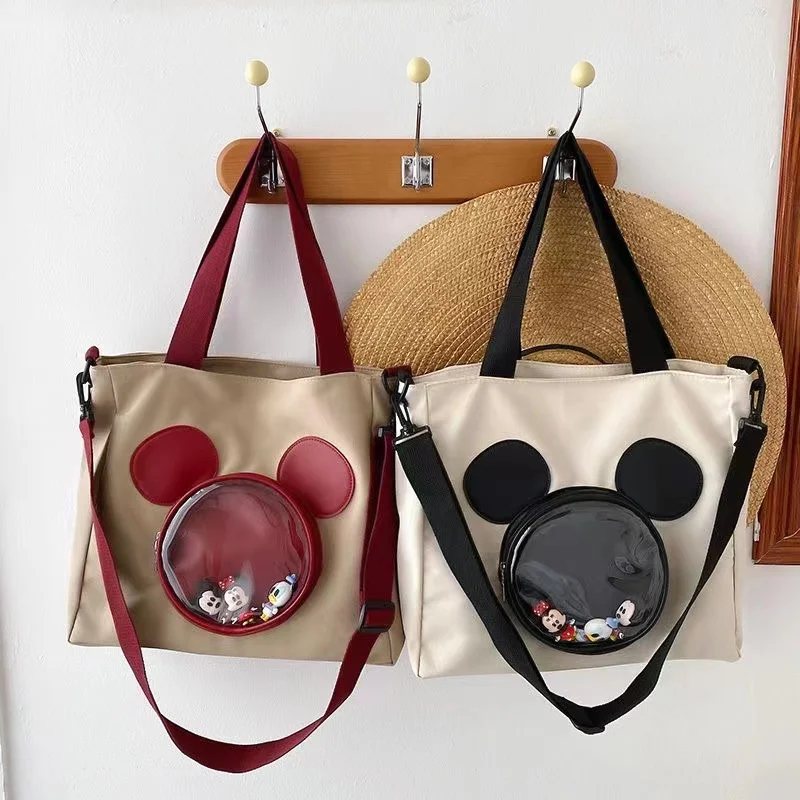 

Mickey Mouse's new large capacity waterproof nylon cloth shoulder bag, cute cartoon student class tutoring crossbody bag