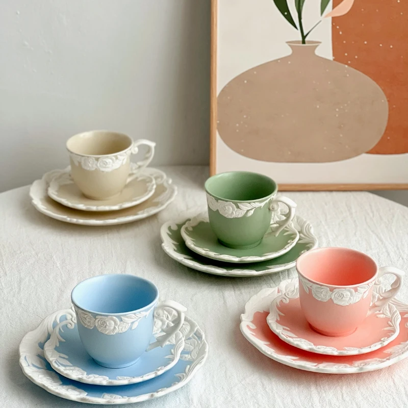 A set of matte relief rose mosaic retro colored ceramic coffee cups and plates