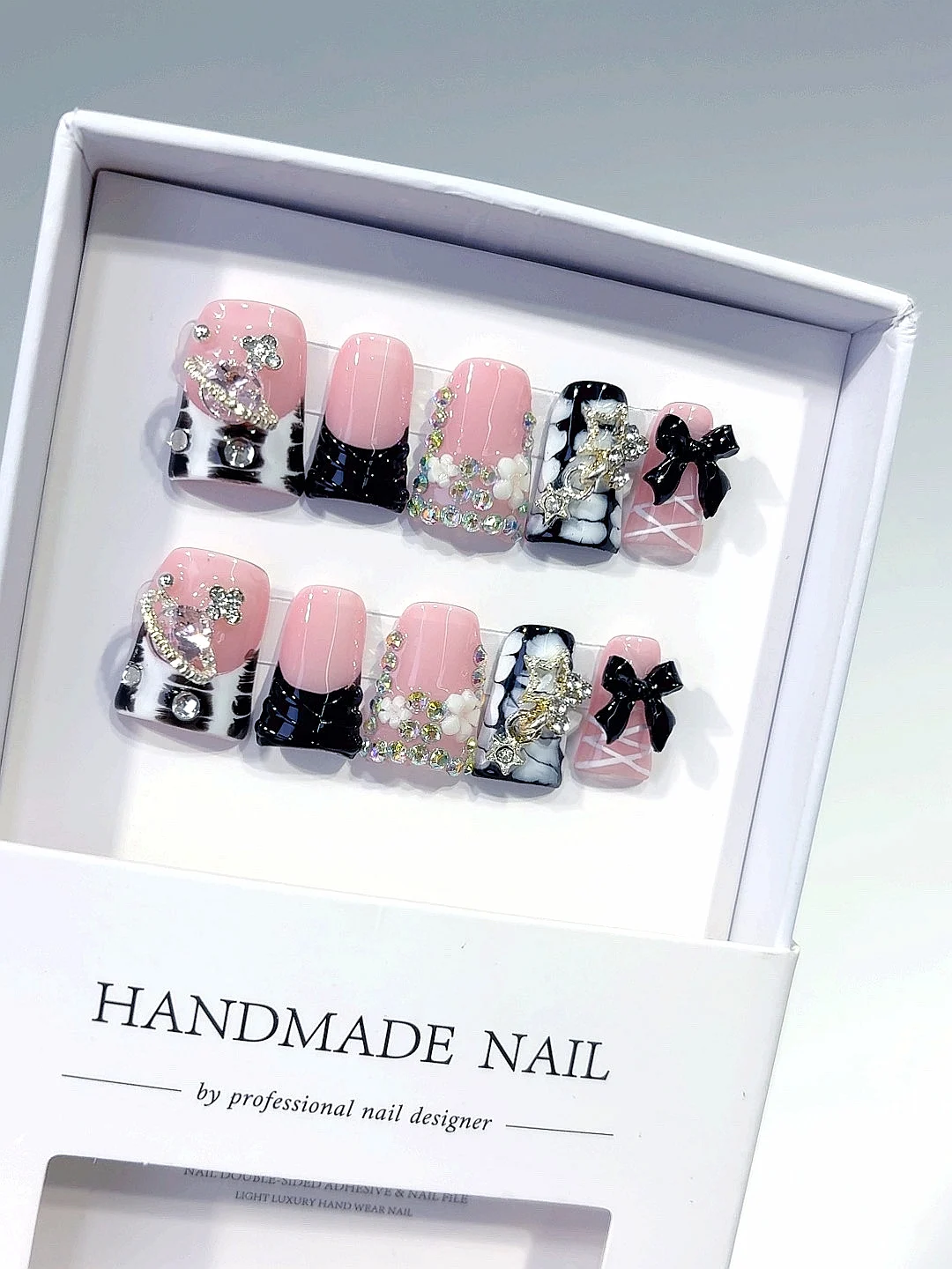 

Пресс для ногтей со стразами розового и черного цвета с бантом (L225)