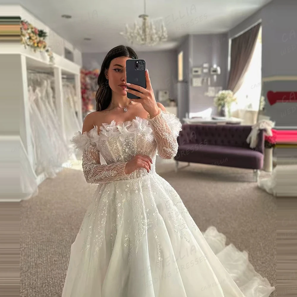 فساتين زفاف فاخرة بخط لامع يزين تول فساتين زفاف نسائية مخصصة طويلة الأكمام قبالة الكتف Vestidos De Novia