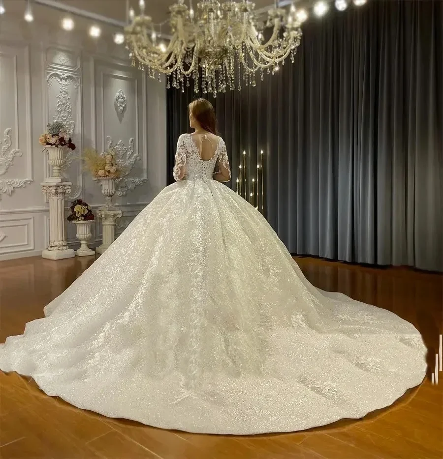 2025 Abiti da ballo di lusso Abito da sposa in pizzo con applicazioni Abito da sposa lucido Sweep Train Maniche lunghe Vestido de novia Personalizzato