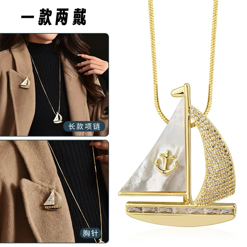 秋冬の新しいロングネックレス、セーリングボート風のセーターチェーン、ツーピースドレス用のコサージュブローチ