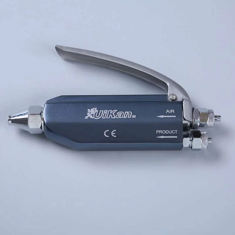Laundry shop stain remover gun Clothing dry cleaning shop stain remover gun Steam stain remover gun on stain removal table Oil a