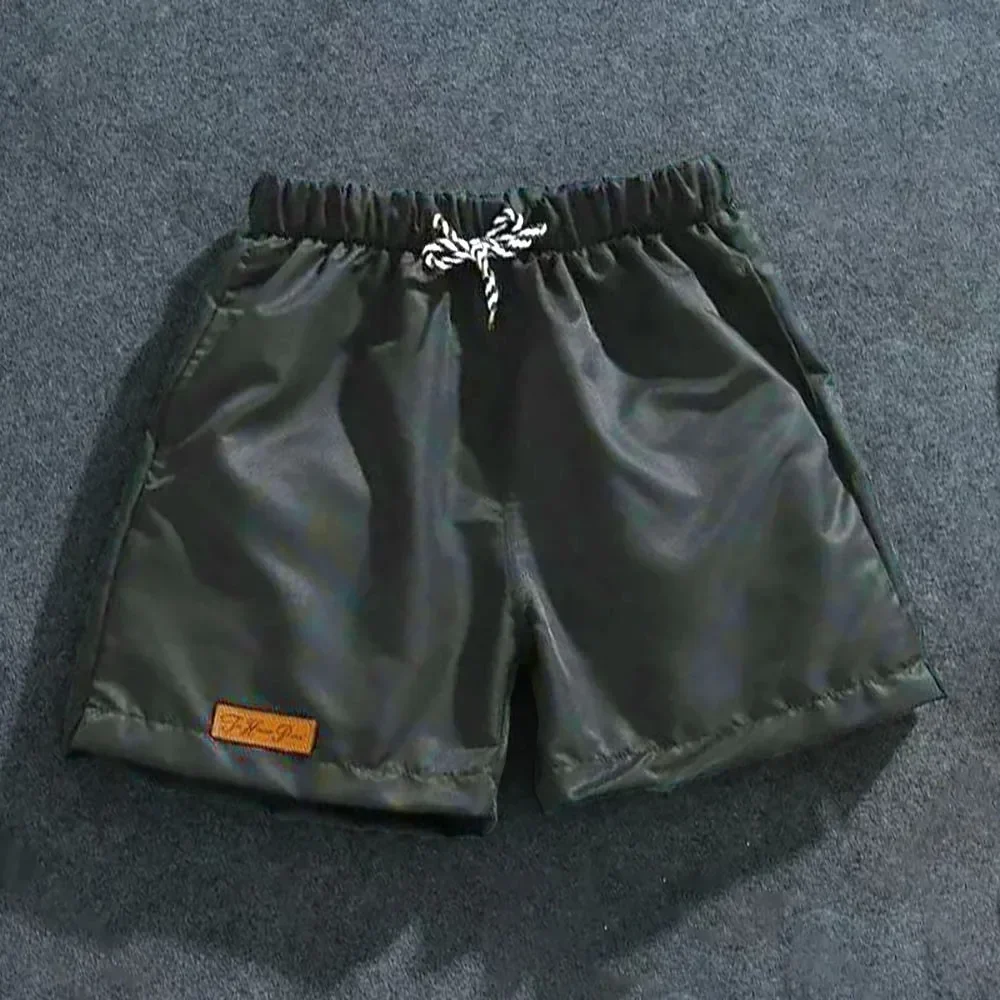 Shorts décontractés à la mode pour hommes, grande taille, demi-pantalon de sport de plage, fitness, cool, course à pied, pantalons d'été, joggeurs unis, nouveau