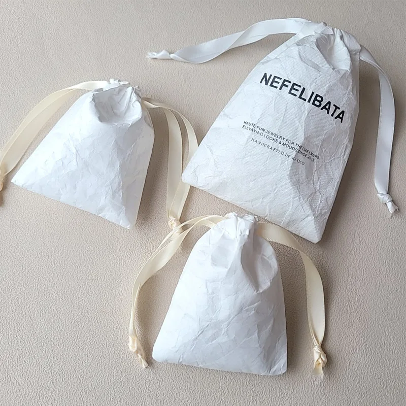 

Eco-friendly Tyvek Paper Drawstring Gift Bags for Oil Perfume Packaging Jewelry Pouch Dust Sack