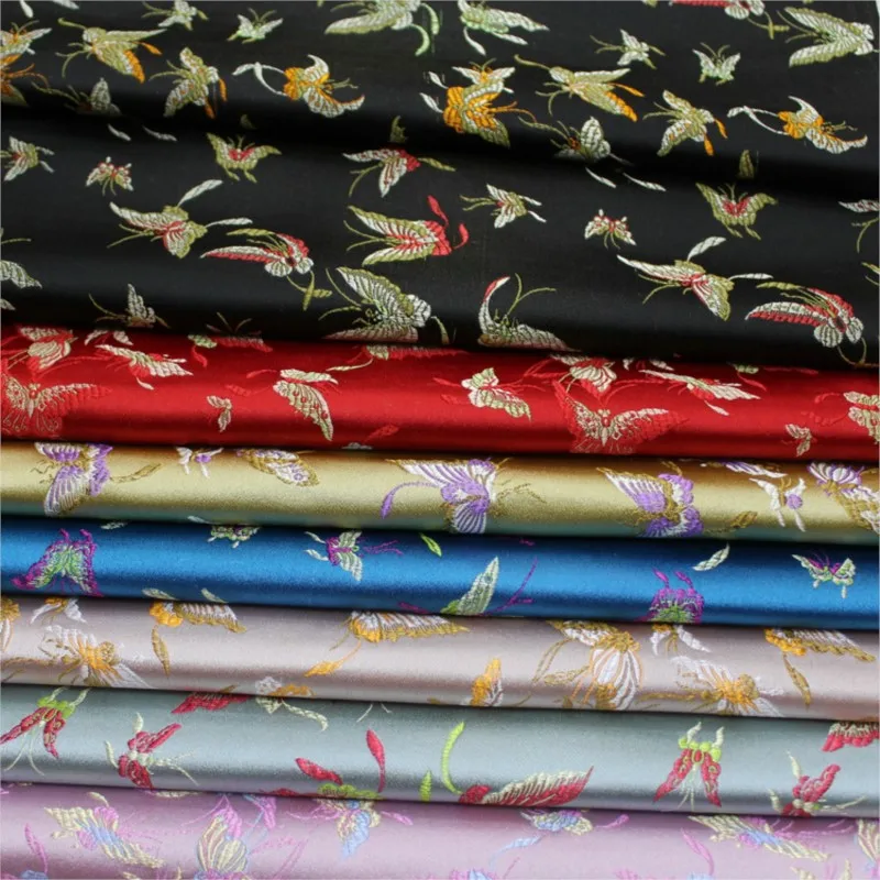 

Chinese-style cheongsam is made of woven silk fabric decorated with hand-woven jacquard brocade and antique