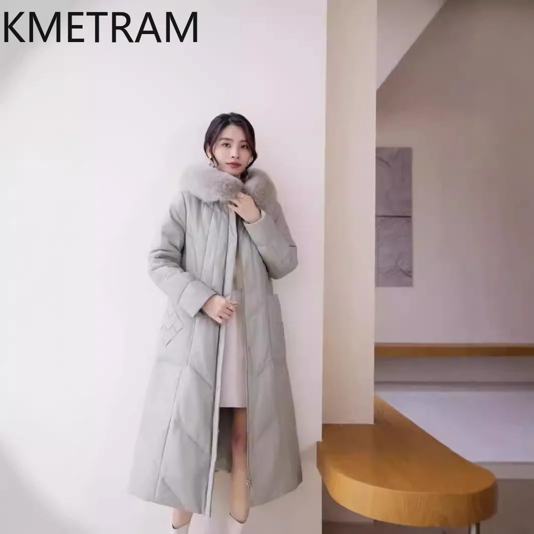 Piumino in pelle di pecora al 100% da donna Cappotti lunghi in vera pelle di alta qualità con cappuccio Collo in pelliccia di volpe 2025 Abiti invernali