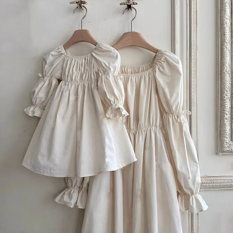 new Korean-style spring dress for parents  children  It features a solid color  elegant puffed-sleeve girl princess doll dress