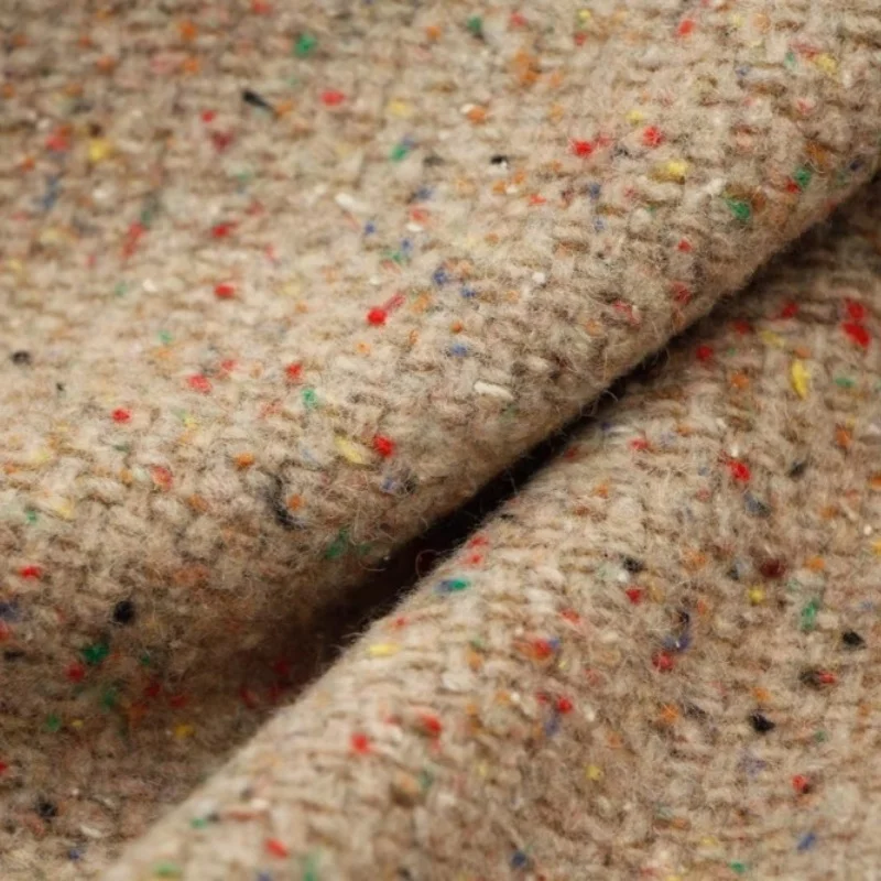 

Khaki brown multi-colored dotted floral woolen fabric for winter and autumn clothing.