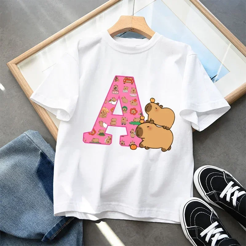 2026 Cute Cartoon Capybara Kids T-Shirt Cotton Short Sleeve A-Z Letter Print Summer Top for Girls Child Fashion Gift Item