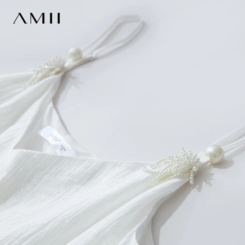 Amiiชุดผู้หญิงMinimalist 2025 ฤดูร้อนสไตล์ใหม่พื้นผิวรู้สึกLyocellลูกปัดดอกไม้VคอSuspenderชุดสีดํา 12542047