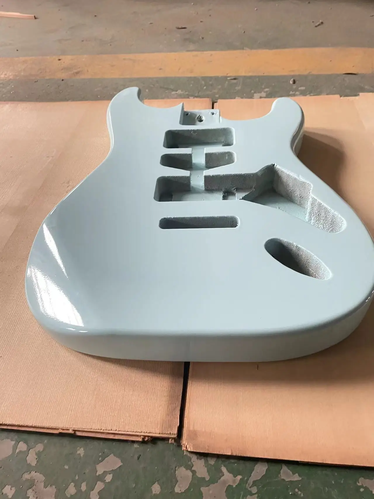 The blue glossy guitar panel is an ST style electric guitar with a half empty heart barrel DIY guitar. The colored guitar body i