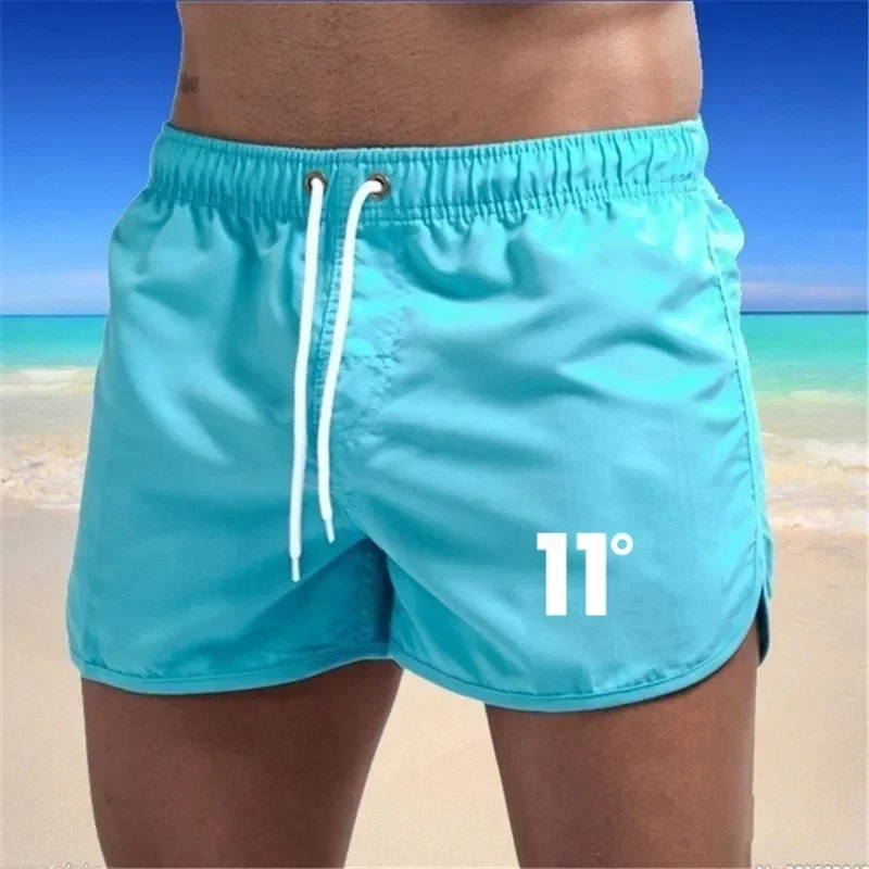 Bañador de secado rápido para hombre, pantalones cortos de playa, Color blanco y negro, talla 11, Color sólido, nueve colores, 2024