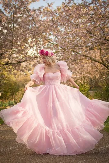 Pink Flowing Gown With Puffy Sleeves And Ruffled Hemline Graceful And Feminine Design Perfect For Formal Occasions Custom Made