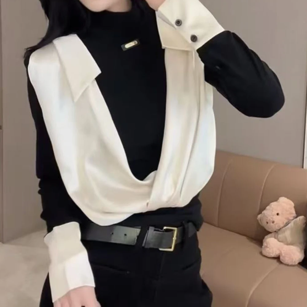 

Fake two-piece turtleneck shirt women's 2026 spring new design sense splicing temperament long-sleeved top