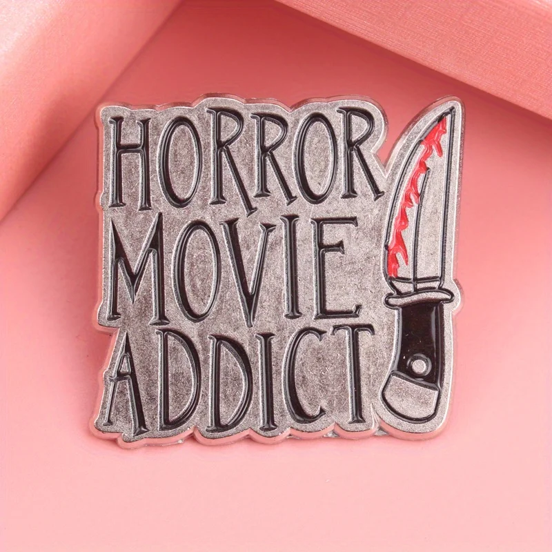 Slasher Cinema Enamel Pin - Distressed Metal Finish with Blood Splatter Knife Motif, 'Horror Movie Addict' Typography for Gore F